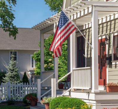Residential real estate property displaying an American flag