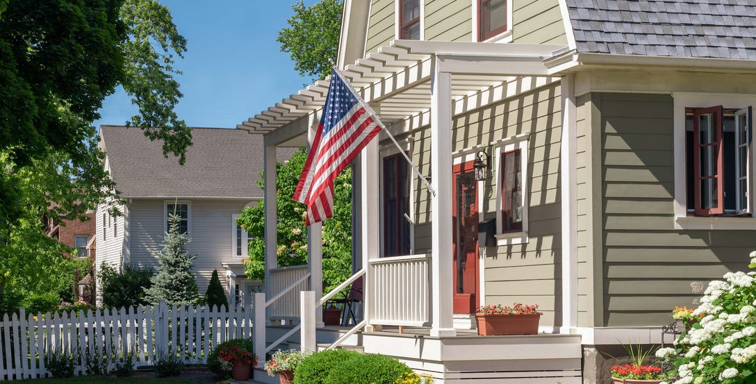 Residential real estate property displaying an American flag